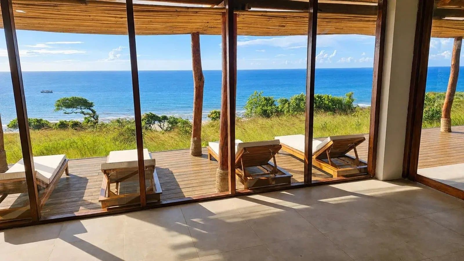 Beachfront deck with loungers looking at the sea at Eco Beach City, Sumba